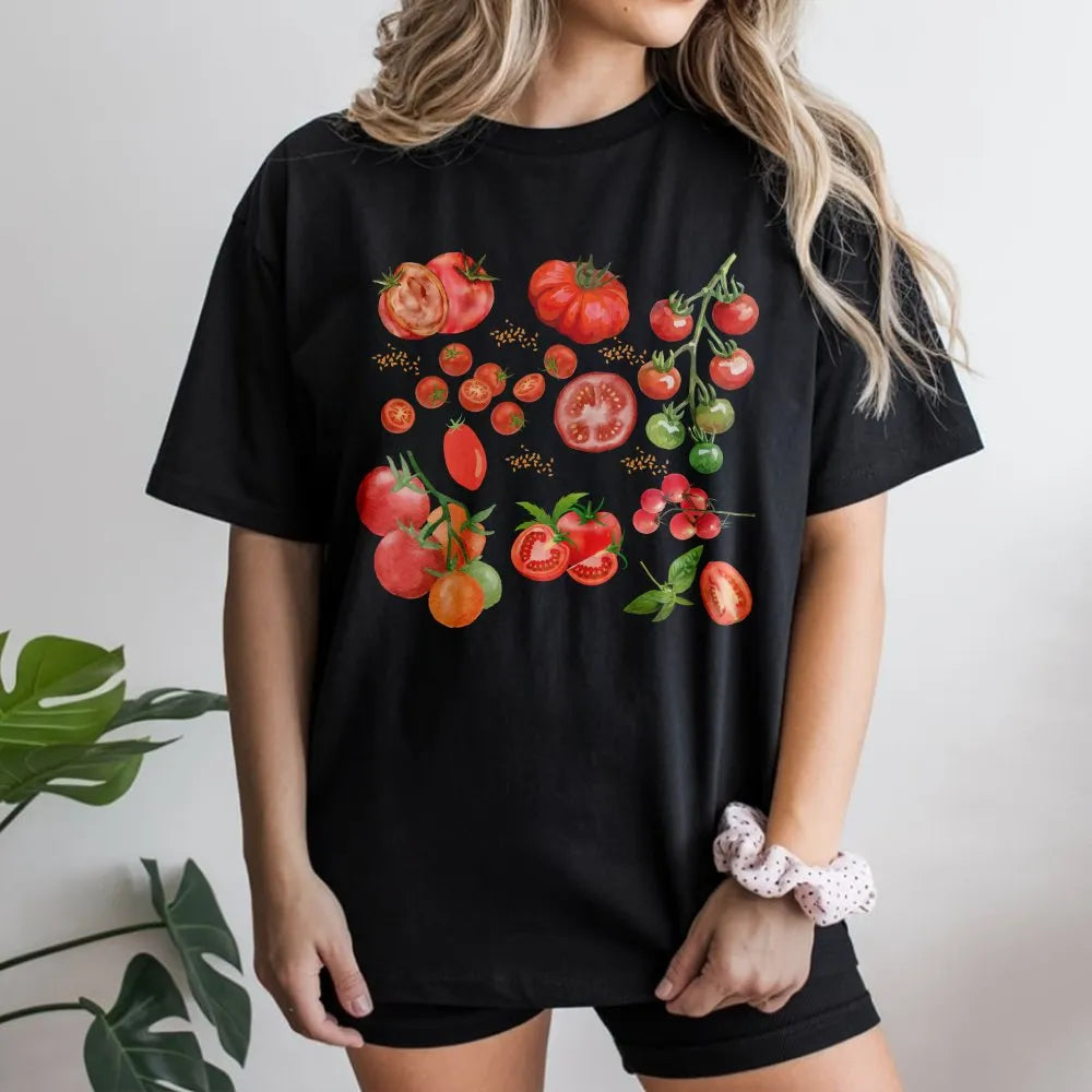 Model wearing a black t-shirt with a vintage tomato botanical print