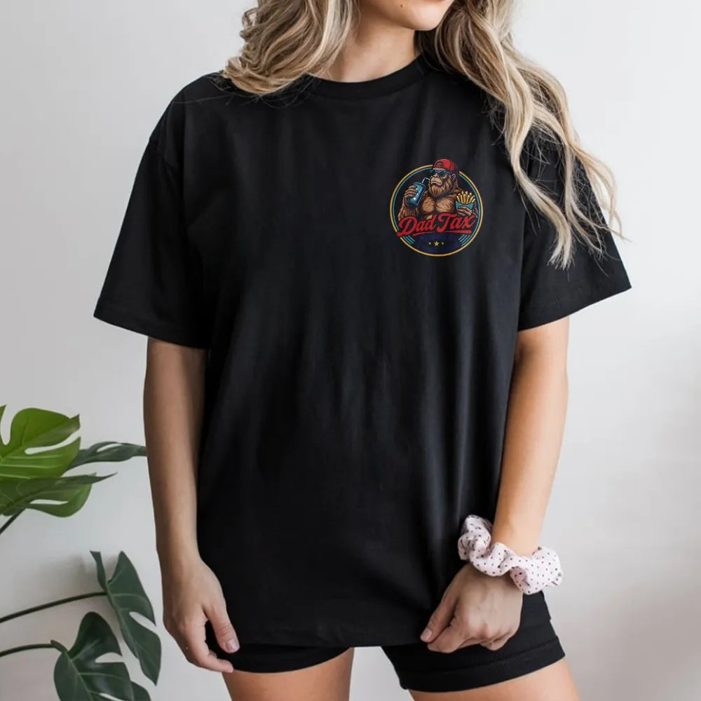 Model wearing a black t-shirt with a Dad Tax retro gorilla print