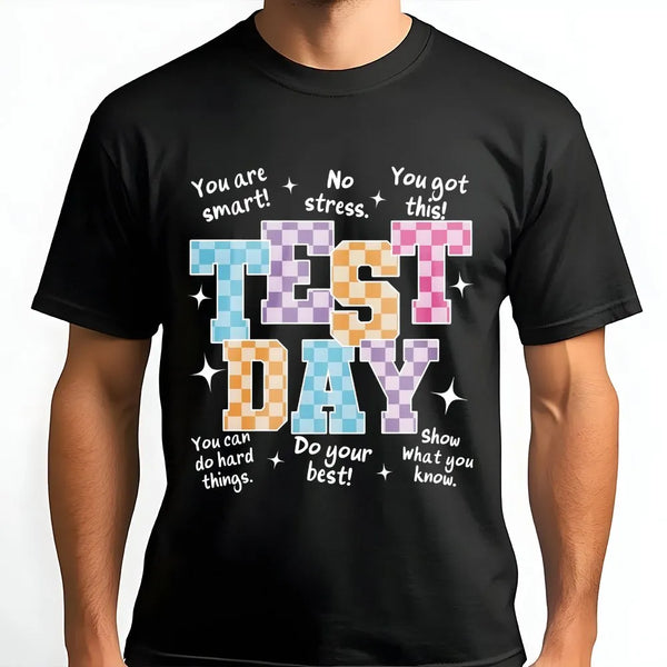Man wearing a black unisex cotton t-shirt with a Test Day retro motivational print